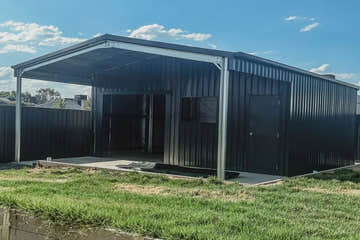 Easyshed Single Garage Shed with motorised roller door and insulated walls