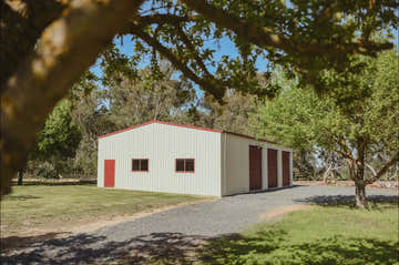 Big practical storage shed with roller doors, windows and personal access door