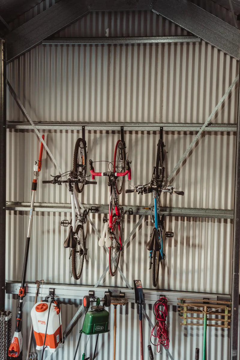 Practical Storage Shed with Wall Mounted Bike and Tool Holders